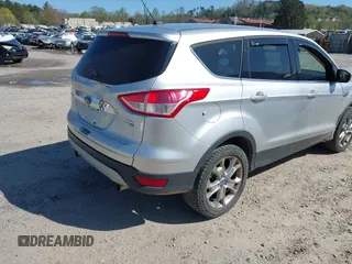 2013 Ford Escape SEL with VIN 1FMCU9H94DUA25017, listed as a IAAI auction lot 41976238 with 171,885 mi miles and . Bid and sale history available at DreamBid. Image 4.