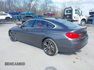 2016 BMW 4 Series 428i xDrive with VIN WBA4C9C56GG140427, listed as a IAAI auction lot 41886670 with 94,426 mi miles and . Bid and sale history available at carsss.com. Image 3.
