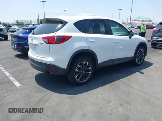 2016 Mazda CX-5 Grand Touring z VIN JM3KE2DY2G0824802, wystawiony jako IAAI lot #42170591 z przebiegiem 53 173 mil mil oraz . Historia ofert i sprzedaży dostępna na DreamBid. Obrazek 4.