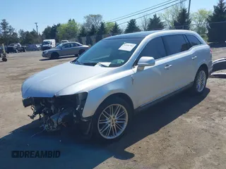 2015 Lincoln MKT EcoBoost with VIN 2LMHJ5AT4FBL00959, listed as a IAAI auction lot 41991763 with 159,687 mi miles and . Bid and sale history available at DreamBid. Image 2.