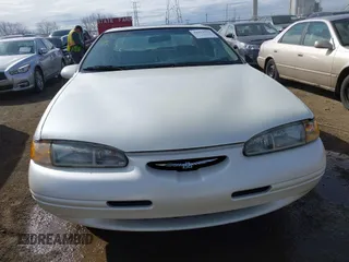 1996 Ford Thunderbird LX z VIN 1FALP6240TH131517, wystawiony jako IAAI lot #41811552 z przebiegiem 87 493 mil mil oraz . Historia ofert i sprzedaży dostępna na DreamBid. Obrazek 12.