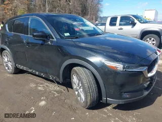 2021 Mazda CX-5 Grand Touring with VIN JM3KFBDM3M1318248, listed as a IAAI auction lot 41678260 with 71,903 mi miles. Bid and sale history available at carsss.com. Image 1.