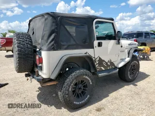 2004 Jeep Wrangler Sport z VIN 1J4FA49SX4P802341, wystawiony jako Copart lot #62752565 z przebiegiem 150 197 mil mil oraz Szkoda całkowita • Salvage title. Historia ofert i sprzedaży dostępna na DreamBid. Obrazek 3.