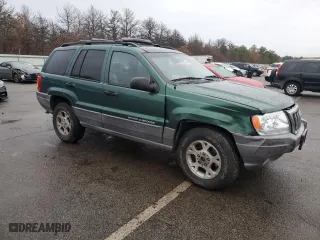 1999 Jeep Grand Cherokee Laredo with VIN 1J4GW58N0XC684111, listed as a Copart auction lot 85944784 with 128,741 mi miles and Salvage Title. Bid and sale history available at carsss.com. Image 4.