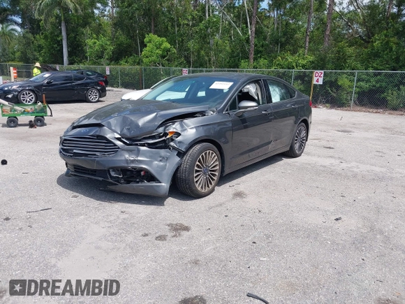 2018 Ford Fusion Titanium with VIN 3FA6P0D9XJR169657, listed as a IAAI auction lot 42392112 with 62,754 mi miles and . Bid and sale history available at DreamBid. Image 2.