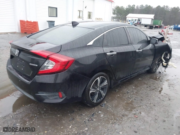 2017 Honda Civic Sedan Touring with VIN 2HGFC1F99HH658034, listed as a IAAI auction lot 41563627 with 140,819 mi miles. Bid and sale history available at carsss.com. Image 4.