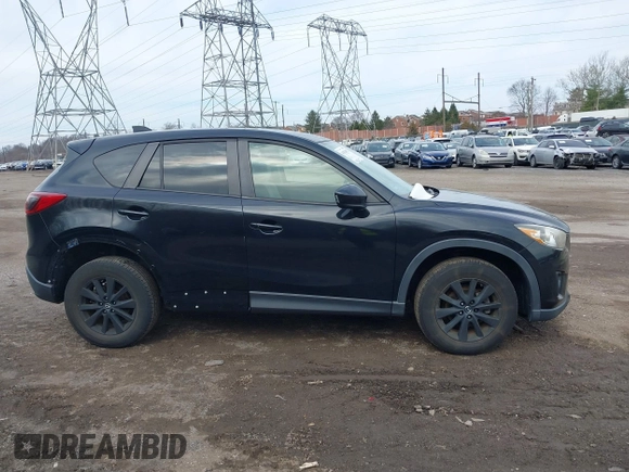 2015 Mazda CX-5 Touring with VIN JM3KE4CY2F0445178, listed as a IAAI auction lot 41828953 with 137,330 mi miles and . Bid and sale history available at DreamBid. Image 14.