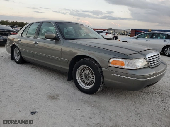 1999 Ford Crown Victoria LX with VIN 2FAFP74W7XX234277, listed as a Copart auction lot 84859854 with 0 mi miles and Clean Title. Bid and sale history available at carsss.com. Image 4.