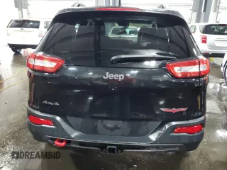 2014 Jeep Cherokee Trailhawk with VIN 1C4PJMBSXEW187981, listed as a Copart auction lot 56711885 with 157,317 mi miles and Salvage title. Bid and sale history available at DreamBid. Image 6.