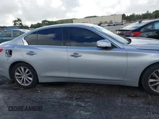 2015 Infiniti Q50 Premium with VIN JN1BV7AP9FM358782, listed as a IAAI auction lot 41103963 with 96,853 mi miles. Bid and sale history available at carsss.com. Image 14.