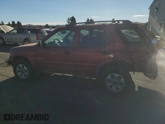 2001 Isuzu Rodeo S with VIN 4S2CK58W014302125, listed as a Copart auction lot 76425614 with 204,350 mi miles and Salvage title. Bid and sale history available at DreamBid. Image 2.