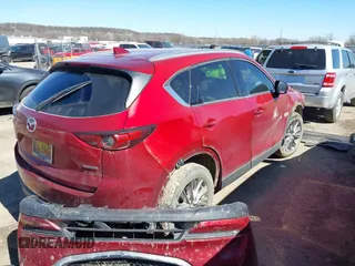 2020 Mazda CX-5 Grand Touring with VIN JM3KFADM3L0761286, listed as a IAAI auction lot 41715379 with 145,656 mi miles and . Bid and sale history available at DreamBid. Image 4.