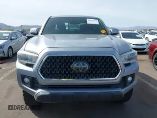 2018 Toyota Tacoma SR5 with VIN 3TMAZ5CN0JM053861, listed as a IAAI auction lot 41920377 with 104,015 mi miles and . Bid and sale history available at DreamBid. Image 12.