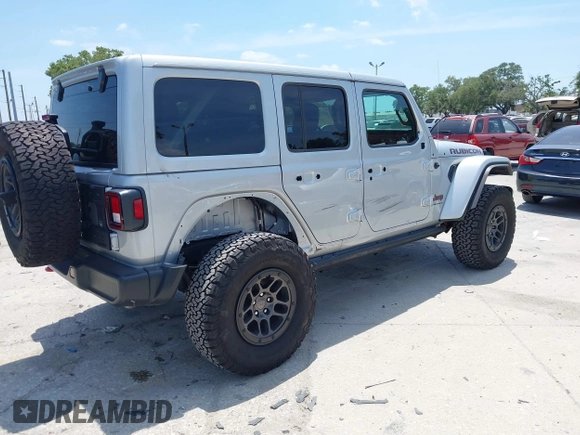 2023 Jeep Wrangler Rubicon with VIN 1C4JJXFG0PW522651, listed as a IAAI auction lot 42112210 with 7,744 mi miles and . Bid and sale history available at DreamBid. Image 4.