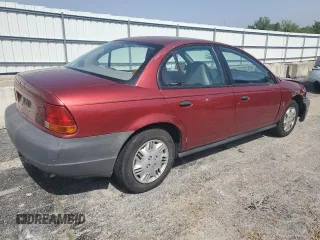 1999 Saturn SL z VIN 1G8ZH5288XZ273509, wystawiony jako Copart lot #55508215 z przebiegiem 168 946 mil mil oraz Szkoda całkowita • Salvage title. Historia ofert i sprzedaży dostępna na DreamBid. Obrazek 3.