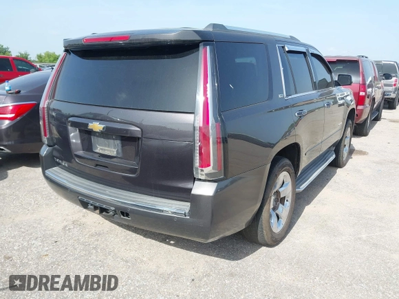 2015 Chevrolet Tahoe LTZ with VIN 1GNSCCKC2FR170090, listed as a IAAI auction lot 42616452 with 249,940 mi miles and . Bid and sale history available at DreamBid. Image 4.
