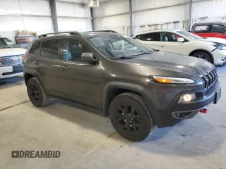 2015 Jeep Cherokee Trailhawk with VIN 1C4PJMBS5FW615845, listed as a Copart auction lot 52824635 with 134,873 mi miles and Salvage Title. Bid and sale history available at carsss.com. Image 4.
