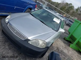 1999 Honda Civic EX with VIN 2HGEJ8649XH590637, listed as a IAAI auction lot 41584579 with 184,999 mi miles. Bid and sale history available at carsss.com. Image 2.