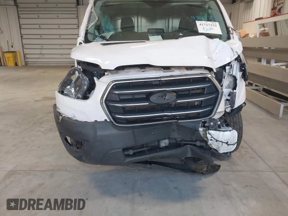 2020 Ford Transit Cargo with VIN 1FTBR1Y81LKA19650, listed as a IAAI auction lot 42727232 with 103,676 mi miles and . Bid and sale history available at DreamBid. Image 6.