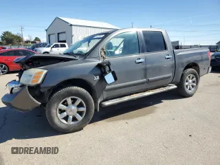 2004 Nissan Titan LE with VIN 1N6AA07B24N575053, listed as a Copart auction lot 50370985 with 230,225 mi miles and Salvage Title. Bid and sale history available at carsss.com. Image 1.