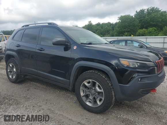 2019 Jeep Cherokee Trailhawk with VIN 1C4PJMBX9KD183116, listed as a Copart auction lot 58518265 with 124,258 mi miles and Salvage title. Bid and sale history available at DreamBid. Image 4.