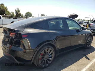 2022 Tesla Model Y Performance with VIN 7SAYGDEF4NF436834, listed as a Copart auction lot 68992234 with 22,171 mi miles and Salvage title. Bid and sale history available at DreamBid. Image 3.