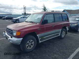1998 Mitsubishi Montero z VIN JA4MR51RXWJ003468, wystawiony jako IAAI lot #41916695 z przebiegiem 214 694 mil mil oraz . Historia ofert i sprzedaży dostępna na DreamBid. Obrazek 2.