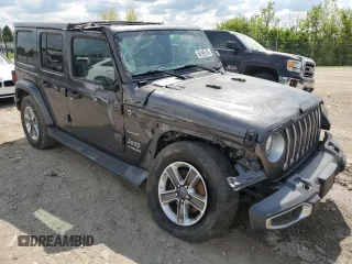 2019 Jeep Wrangler Unlimited Sahara with VIN 1C4HJXENXKW521630, listed as a Copart auction lot 56196145 with 56,753 mi miles and Salvage title. Bid and sale history available at DreamBid. Image 4.