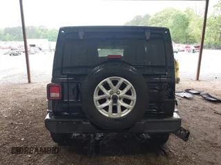 2023 Jeep Wrangler Willys with VIN 1C4HJXDG0PW617101, listed as a IAAI auction lot 42111687 with 56,415 mi miles and . Bid and sale history available at DreamBid. Image 17.
