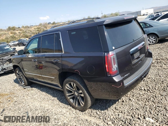2018 GMC Yukon Denali with VIN 1GKS2CKJXJR217857, listed as a Copart auction lot 62943934 with 122,015 mi miles and Salvage Title. Bid and sale history available at carsss.com. Image 2.