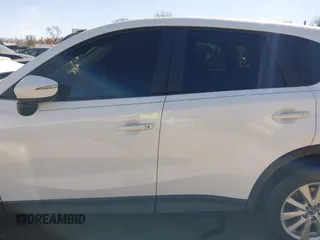 2016 Mazda CX-5 Sport with VIN JM3KE2BY9G0890587, listed as a IAAI auction lot 41685344 with 91,190 mi miles. Bid and sale history available at carsss.com. Image 14.