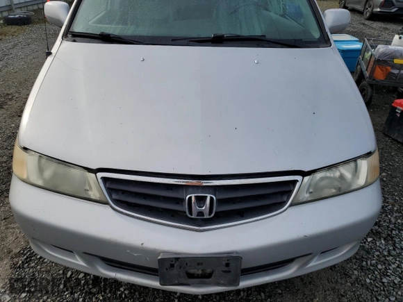 2002 Honda Odyssey EX z VIN 2HKRL18692H578746, wystawiony jako Copart lot #51281845 z przebiegiem 282 844 mil mil oraz Szkoda całkowita • Salvage title. Historia ofert i sprzedaży dostępna na DreamBid. Obrazek 12.