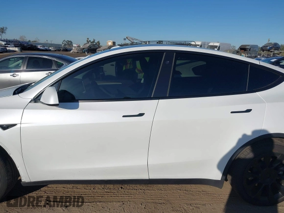 2023 Tesla Model Y Long Range with VIN 7SAYGDEE1PA128818, listed as a IAAI auction lot 41622062 with 19,089 mi miles. Bid and sale history available at carsss.com. Image 15.