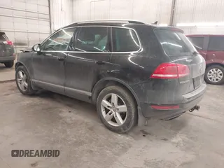 2012 Volkswagen Touareg Sport with VIN WVGEF9BP8CD009511, listed as a IAAI auction lot 41457989 with 87,325 mi miles and . Bid and sale history available at DreamBid. Image 3.