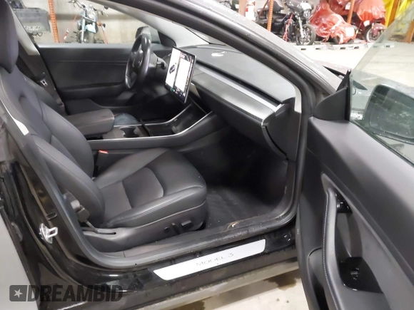 2018 Tesla Model 3 Long Range Battery with VIN 5YJ3E1EB8JF113566, listed as a IAAI auction lot 41726484 with 91,255 mi miles and . Bid and sale history available at DreamBid. Image 5.