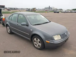 2004 Volkswagen Jetta GLS z VIN 3VWSK69M74M005594, wystawiony jako IAAI lot #42315487 z przebiegiem 98 999 mil mil oraz . Historia ofert i sprzedaży dostępna na DreamBid. Obrazek 1.