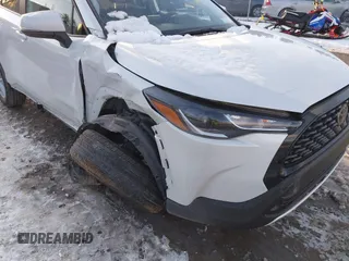 2024 Toyota Corolla Cross LE with VIN 7MUBAABG0RV097884, listed as a IAAI auction lot 41447543 with 8,396 mi miles and . Bid and sale history available at DreamBid. Image 6.