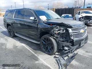 2015 Chevrolet Suburban LTZ with VIN 1GNSCKKC0FR228045, listed as a IAAI auction lot 41141374 with 155,914 mi miles. Bid and sale history available at carsss.com. Image 1.