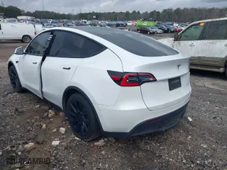 2021 Tesla Model Y Long Range with VIN 5YJYGDEE3MF087054, listed as a IAAI auction lot 41728040 with 64,228 mi miles. Bid and sale history available at carsss.com. Image 3.