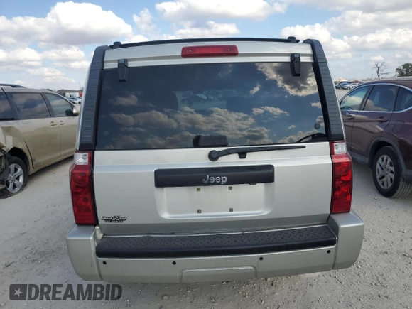 2009 Jeep Commander Sport with VIN 1J8HH48K59C514861, listed as a Copart auction lot 44076015 with 129,674 mi miles and Salvage title. Bid and sale history available at DreamBid. Image 6.
