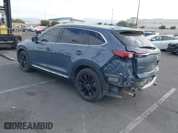 2021 Mazda CX-9 Grand Touring with VIN JM3TCADY1M0519288, listed as a IAAI auction lot 41186094 with 50,701 mi miles and . Bid and sale history available at DreamBid. Image 3.