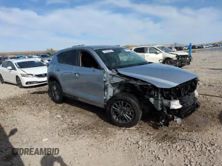 2020 Mazda CX-5 Touring with VIN JM3KFBCMXL0767254, listed as a Copart auction lot 52189335 with 96,922 mi miles and Salvage Title. Bid and sale history available at carsss.com. Image 4.