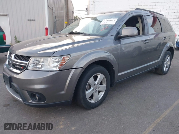 2012 Dodge Journey SXT with VIN 3C4PDDBG2CT333537, listed as a IAAI auction lot 42556329 with 172,834 mi miles and . Bid and sale history available at DreamBid. Image 2.