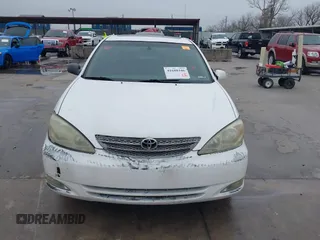 2003 Toyota Camry LE z VIN JTDBF30K530148403, wystawiony jako IAAI lot #41688346 z przebiegiem 299 143 mil mil oraz . Historia ofert i sprzedaży dostępna na DreamBid. Obrazek 12.