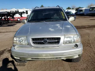 1999 Suzuki Grand Vitara JLX z VIN JS3TD62V0X4113058, wystawiony jako Copart lot #80089884 z przebiegiem 165 794 mil mil oraz Szkoda całkowita • Salvage title. Historia ofert i sprzedaży dostępna na DreamBid. Obrazek 5.