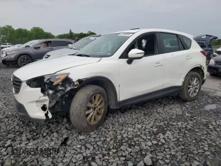 2016 Mazda CX-5 Sport z VIN JM3KE4BY4G0899953, wystawiony jako Copart lot #57269035 z przebiegiem 196 158 mil mil oraz Szkoda całkowita • Salvage title. Historia ofert i sprzedaży dostępna na DreamBid. Obrazek 1.