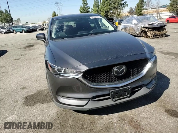 2020 Mazda CX-5 Touring with VIN JM3KFACM9L0815692, listed as a Copart auction lot 52431295 with 59,359 mi miles and Salvage Title. Bid and sale history available at DreamBid. Image 12.
