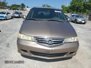 2004 Honda Odyssey EX-RES z VIN 5FNRL18814B125773, wystawiony jako Copart lot #58205565 z przebiegiem 250 732 mil mil oraz Szkoda całkowita • Salvage title. Historia ofert i sprzedaży dostępna na DreamBid. Obrazek 5.