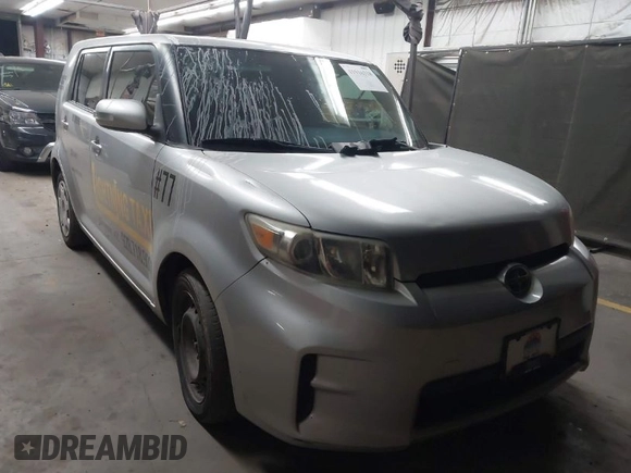 2012 Scion xB with VIN JTLZE4FE5CJ028608, listed as a IAAI auction lot 41916318 with 233,007 mi miles. Bid and sale history available at carsss.com. Image 1.