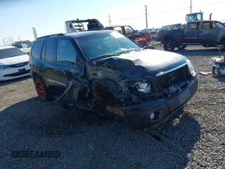 2002 GMC Envoy SLT with VIN 1GKDT13S522146661, listed as a IAAI auction lot 40502587 with 274,877 mi miles. Bid and sale history available at carsss.com. Image 1.